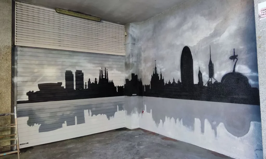 Graffiti del skyline de Barcelona pintado en parking interior con arte urbano