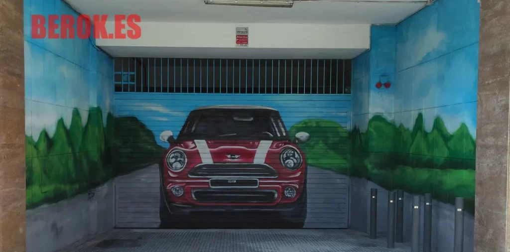 Graffiti coche mini rojo en garaje con carretera y vegetación